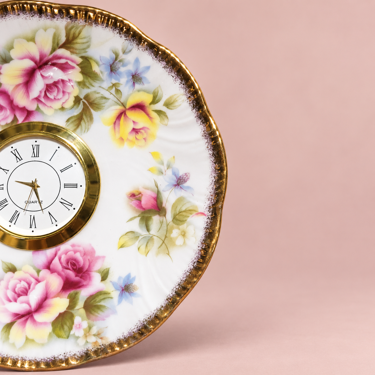 Woodland floral plate clock with a cream-and-olive blossom, colourful foliage and a scalloped gold rim