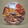 Autumn Crossing tabletop clock featuring a covered bridge and colourful autumn trees