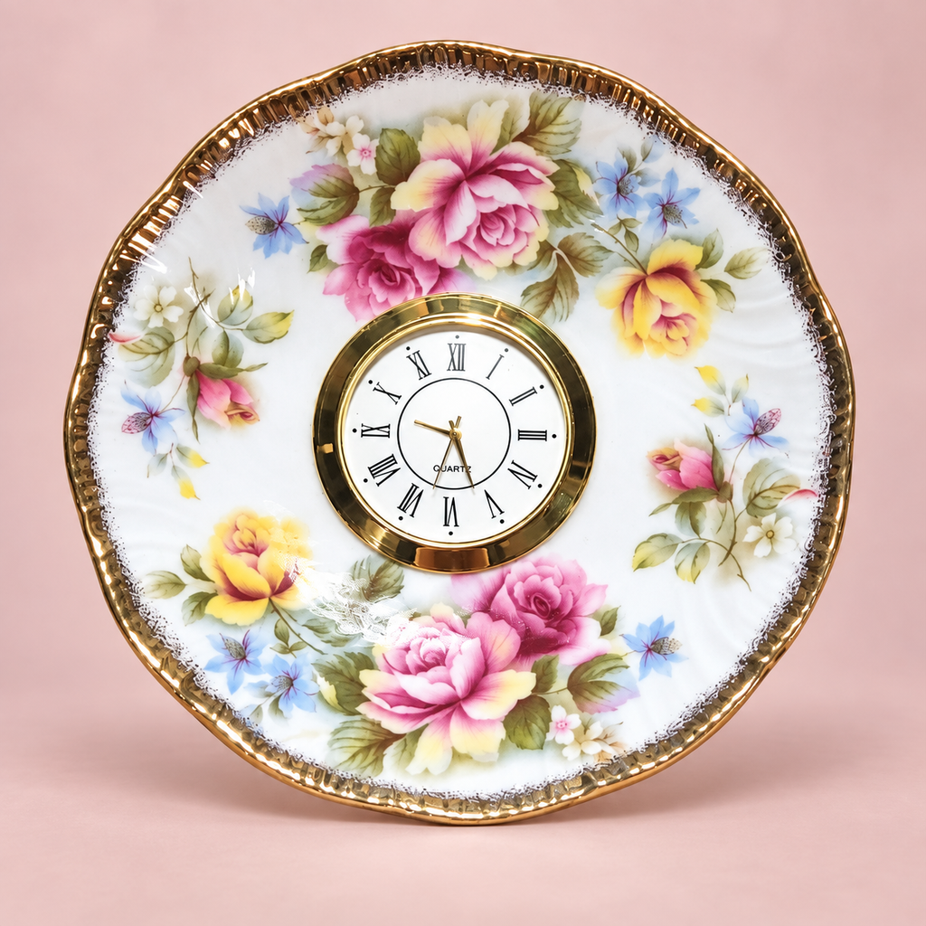 Woodland floral plate clock with a cream-and-olive blossom, colourful foliage and a scalloped gold rim