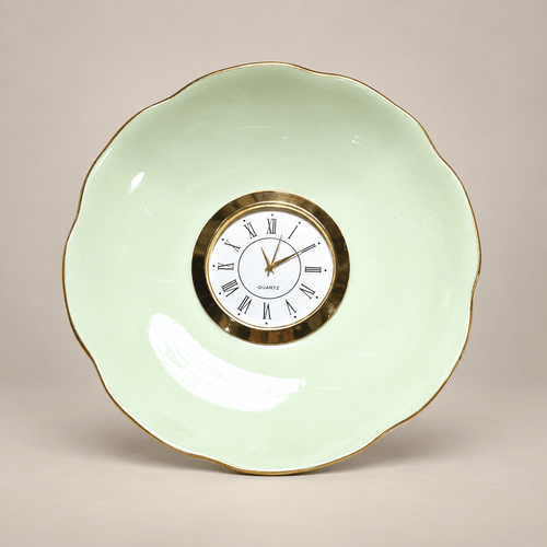 Celadon china plate clock with a pale-green scalloped plate, slender gold rim and gold Roman numeral clock face